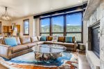 The open concept living area is surrounded by views